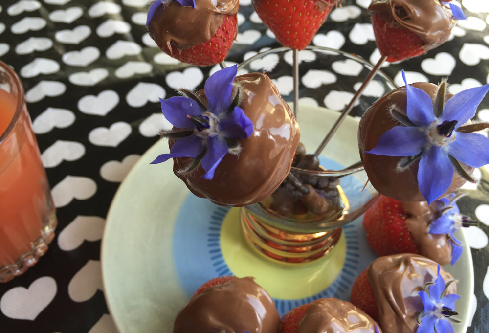 Edible flower borage and strawberries